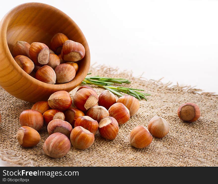 Hazelnuts, filbert on old wooden background