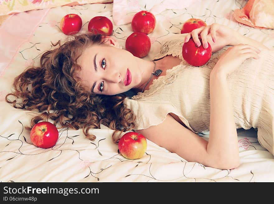 Portrait of beautiful young woman with look in the morning in bed. Portrait of beautiful young woman with look in the morning in bed