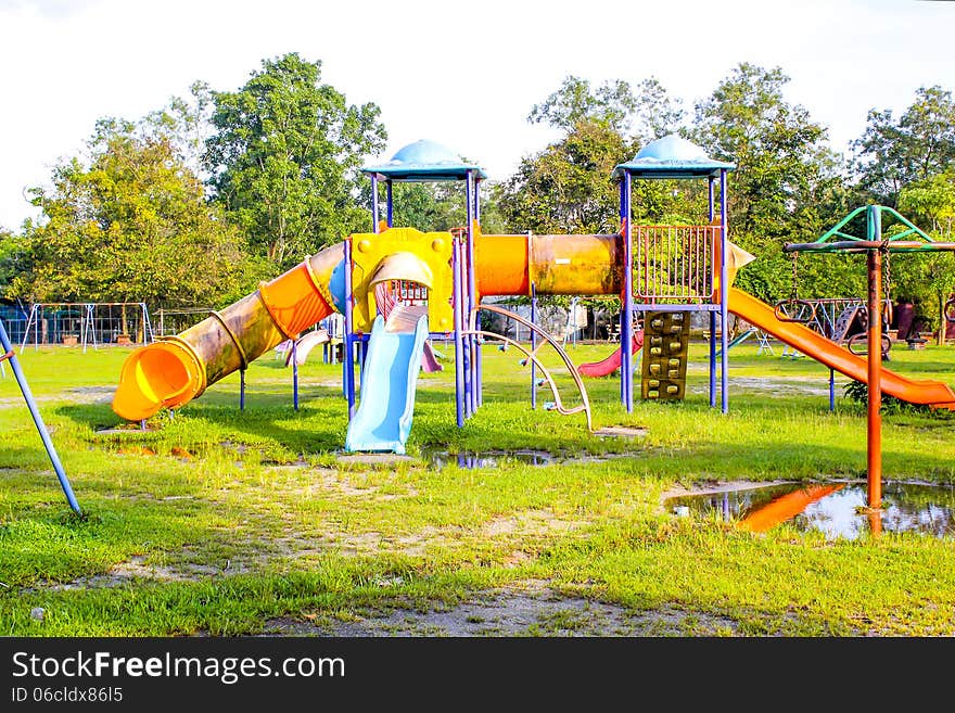 Playground Park On Grass Near School Is Children