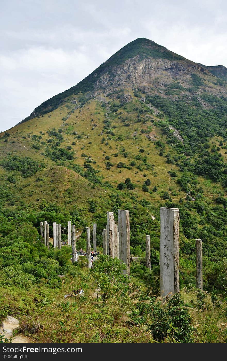 Lantau Island Wisdom Path - 38 calligraphies by famous contemporary scholar Professor Jao Tsung-I of verses from the Heart Sutra on as many high wooden columns reminiscent of bamboo tiles (zhujian), set within a figure 8 to symbolise infinity. Lantau Island Wisdom Path - 38 calligraphies by famous contemporary scholar Professor Jao Tsung-I of verses from the Heart Sutra on as many high wooden columns reminiscent of bamboo tiles (zhujian), set within a figure 8 to symbolise infinity.