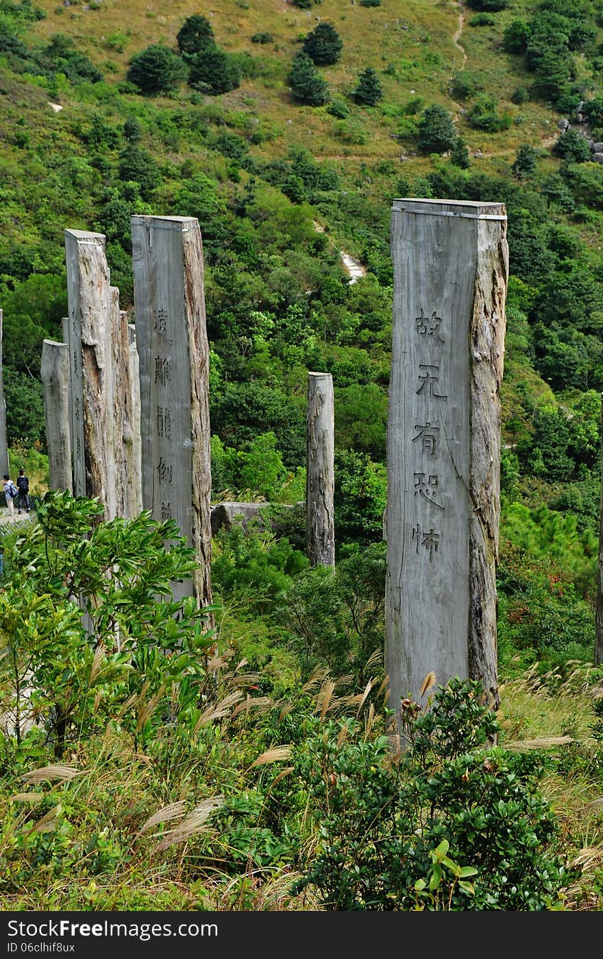 Lantau Island Wisdom Path - 38 calligraphies by famous contemporary scholar Professor Jao Tsung-I of verses from the Heart Sutra on as many high wooden columns reminiscent of bamboo tiles (zhujian), set within a figure 8 to symbolise infinity. Lantau Island Wisdom Path - 38 calligraphies by famous contemporary scholar Professor Jao Tsung-I of verses from the Heart Sutra on as many high wooden columns reminiscent of bamboo tiles (zhujian), set within a figure 8 to symbolise infinity.