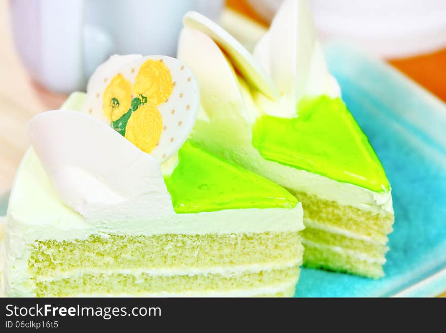 Sweet cake with flower and green cream. Sweet cake with flower and green cream