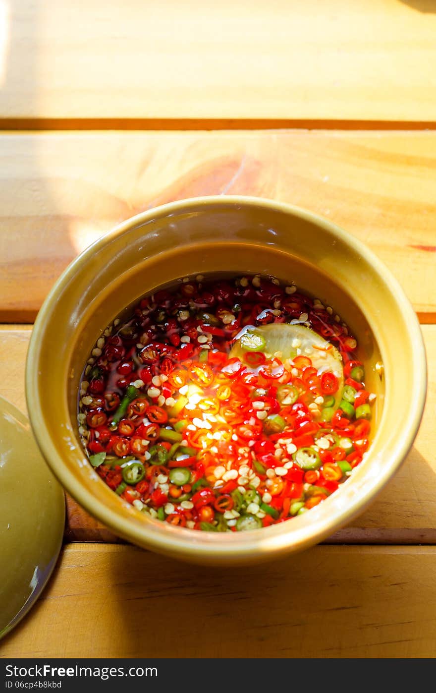 Chili thai style sauce in bowl on table. Chili thai style sauce in bowl on table