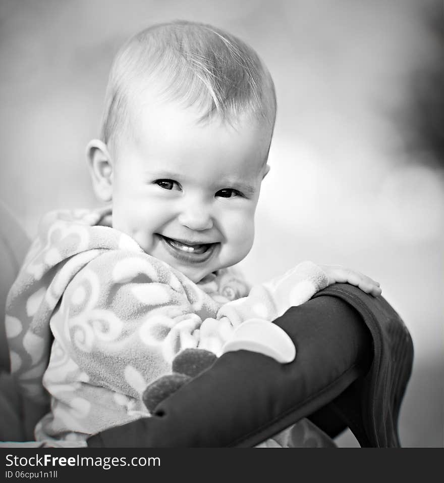 A happy baby laughing and smiling monochrome