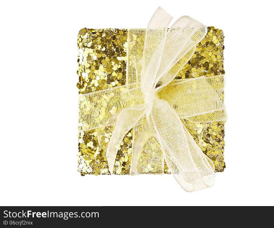 Top view of gold glitter gift box on white background. Top view of gold glitter gift box on white background