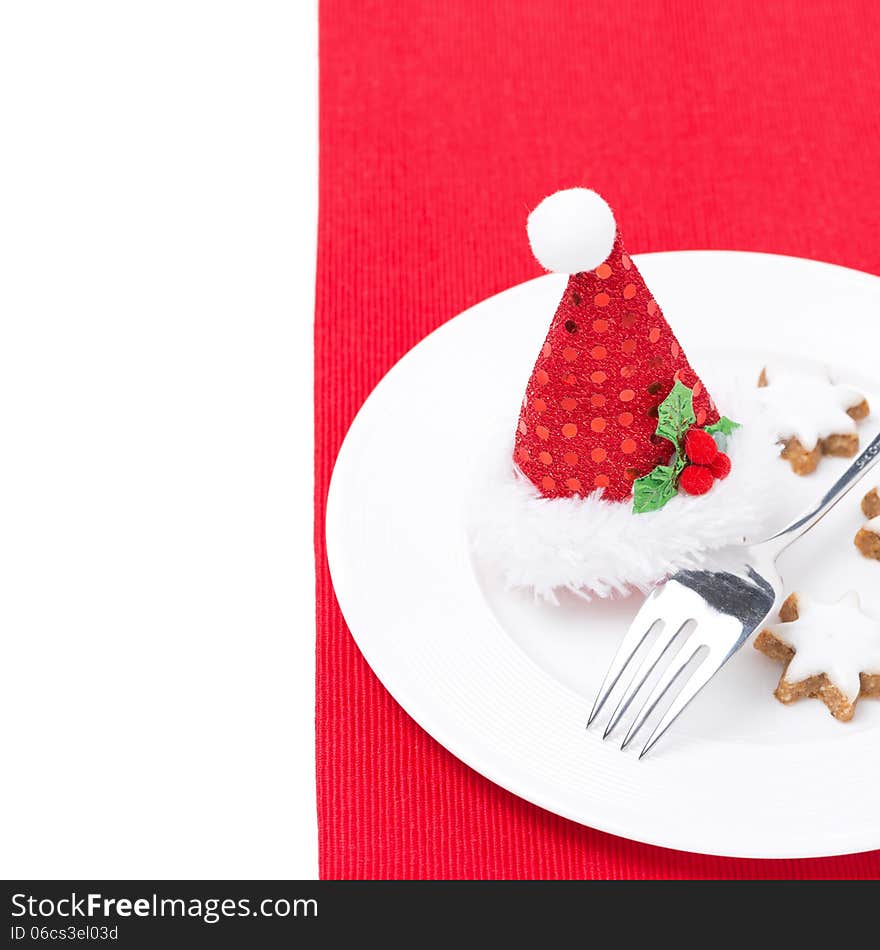 Christmas table setting on a red napkin, isolated on white