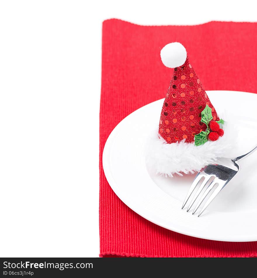 Christmas table setting on a red napkin, isolated