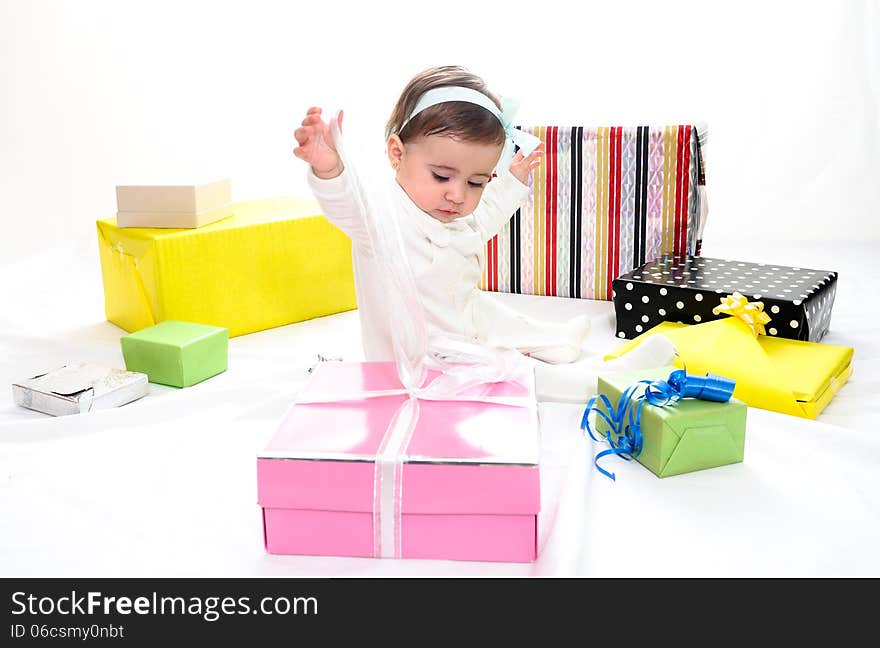 Portrait of a baby girl with gifts