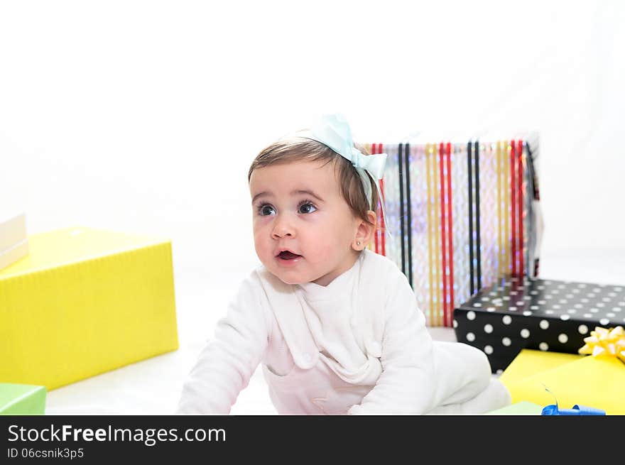 Portrait of a baby girl with gifts