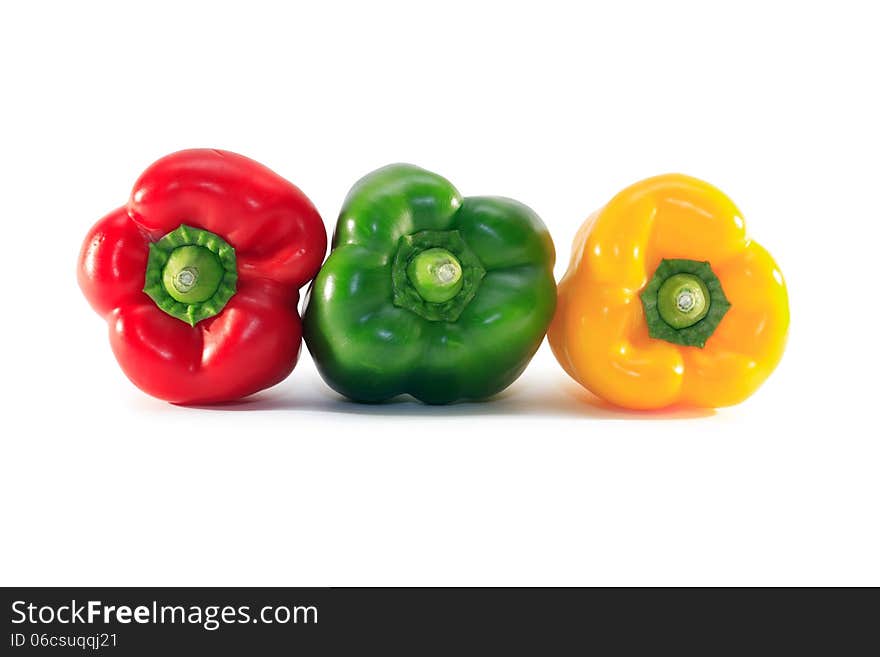 Three colored sweet pepper on white background. Clipping path is included