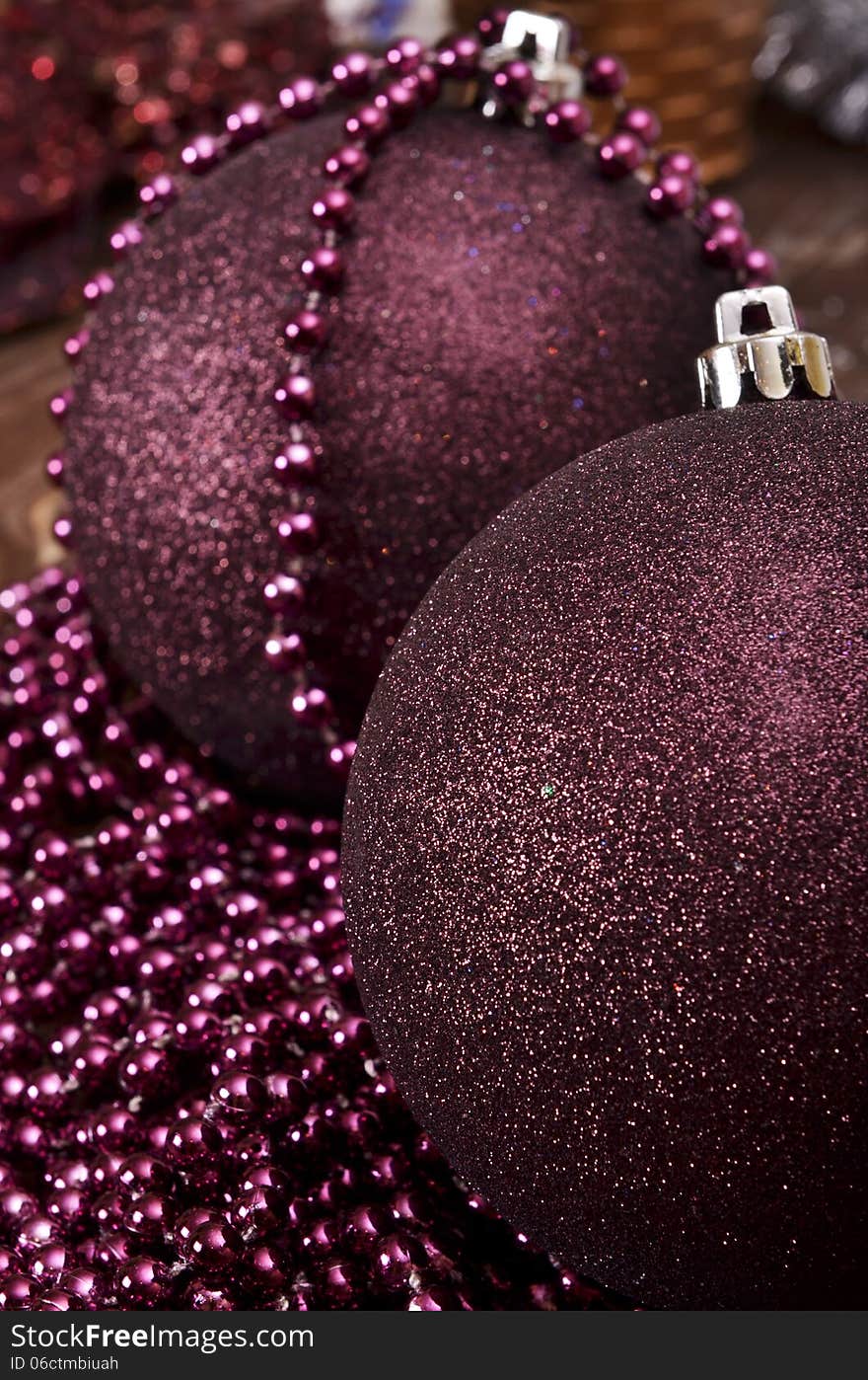 Large Christmas Balls And Beads On A Wooden Background