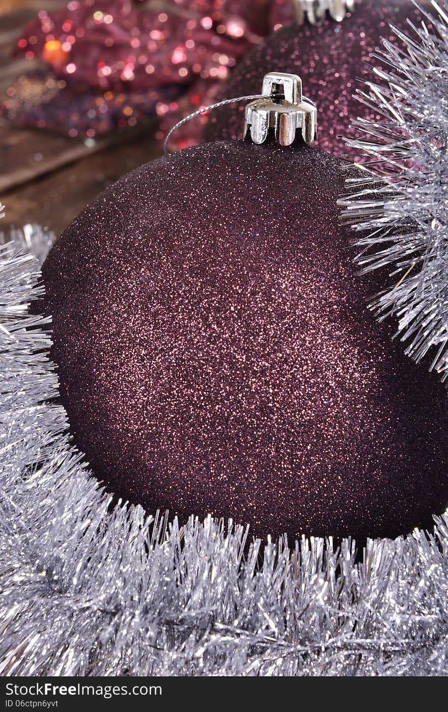 Christmas balls and tinsel on wooden background. Christmas balls and tinsel on wooden background