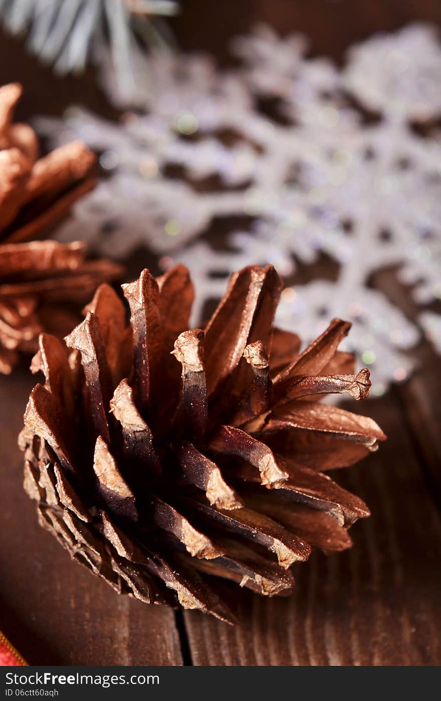 New Year`s composition of a pine cones and snowflakes