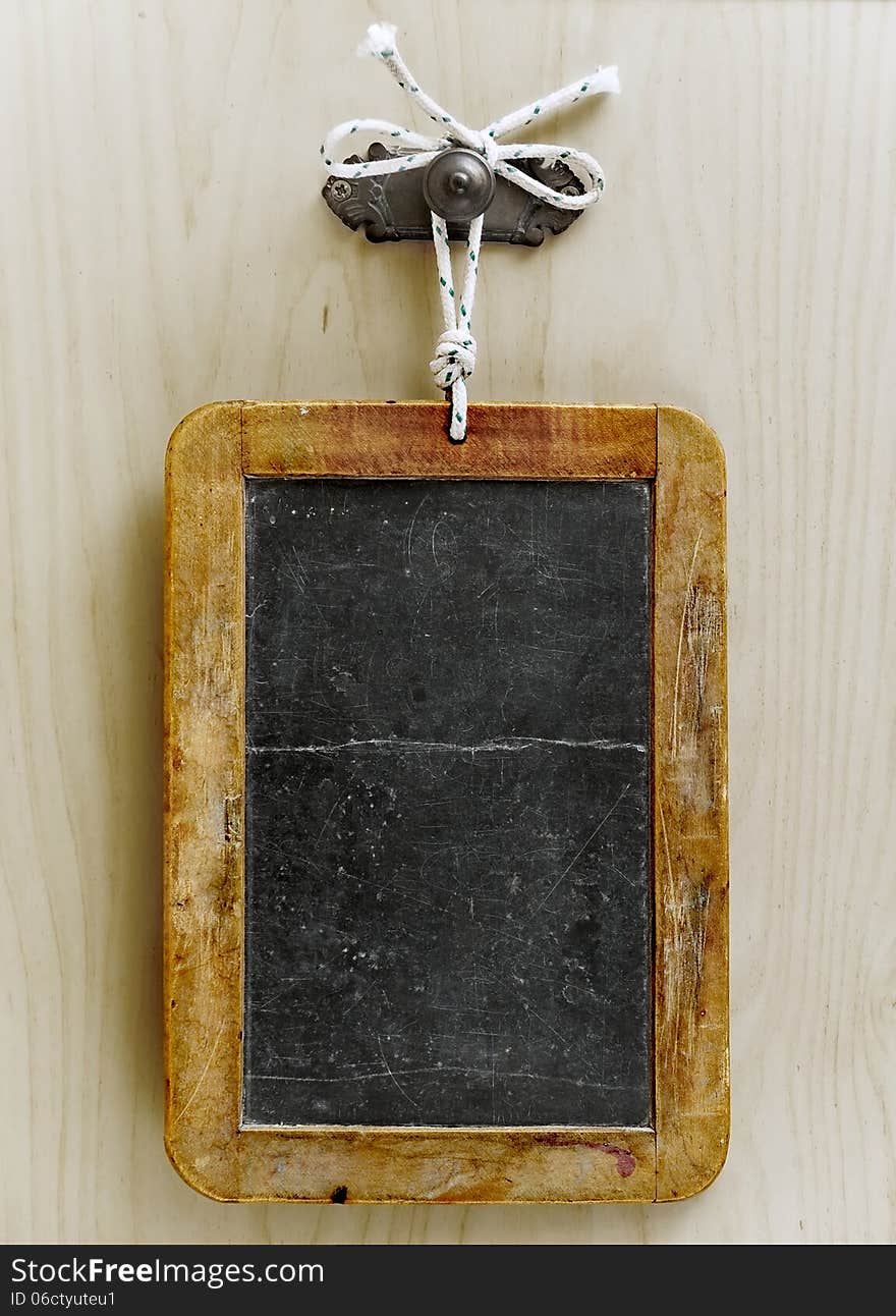 Aged blackboard on a wooden wall. Aged blackboard on a wooden wall.