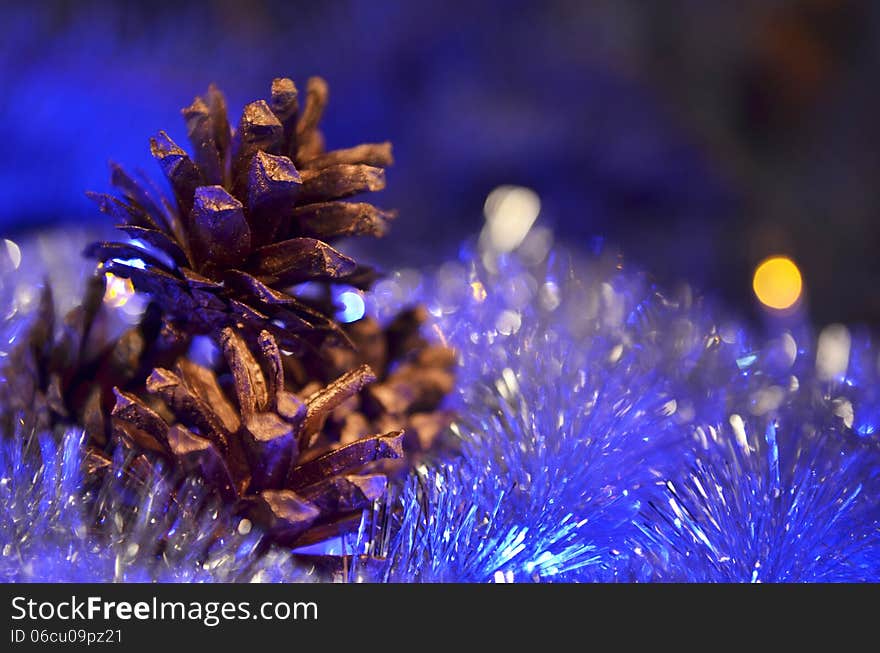 New Year`s composition of a pine cones and tinsel