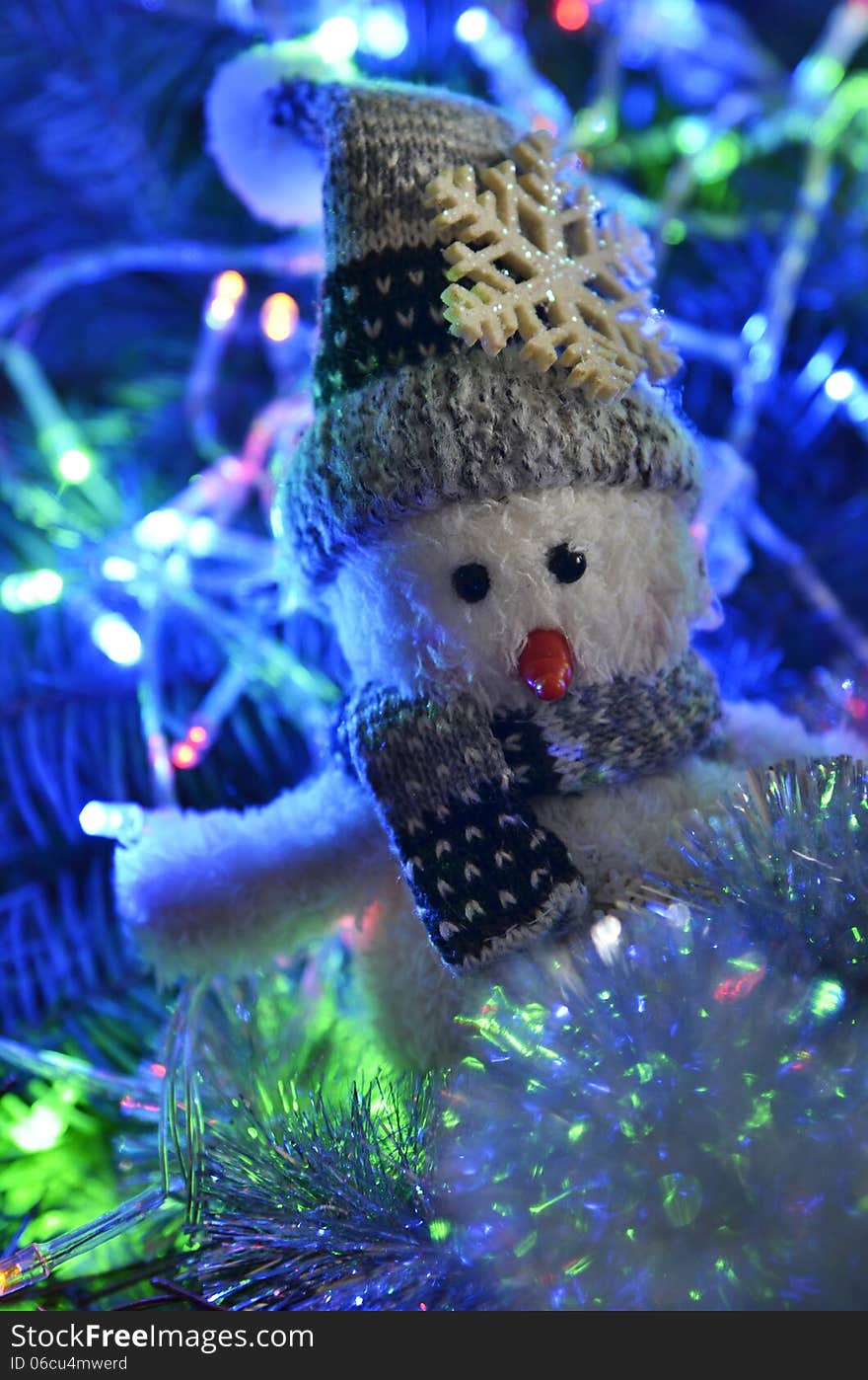 New Year`s composition of a snowman and lights