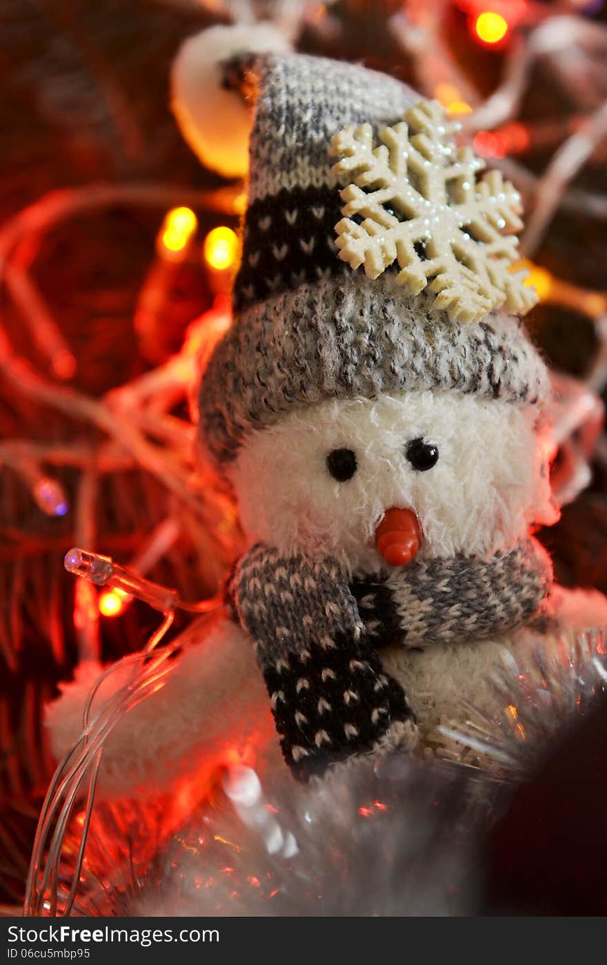 New Year`s composition of a snowman and lights