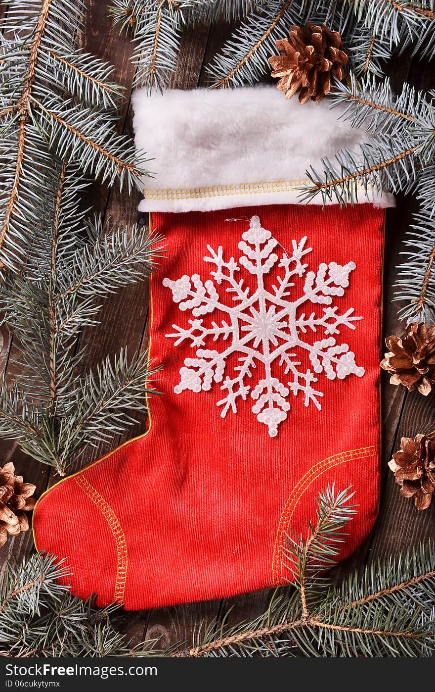 New Year`s composition of a red Christmas sock and snowflakes. New Year`s composition of a red Christmas sock and snowflakes