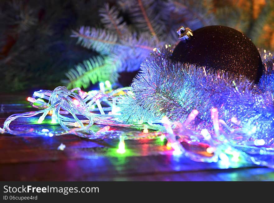 Composition of colorful Christmas balls, cones and Christmas lights. Composition of colorful Christmas balls, cones and Christmas lights