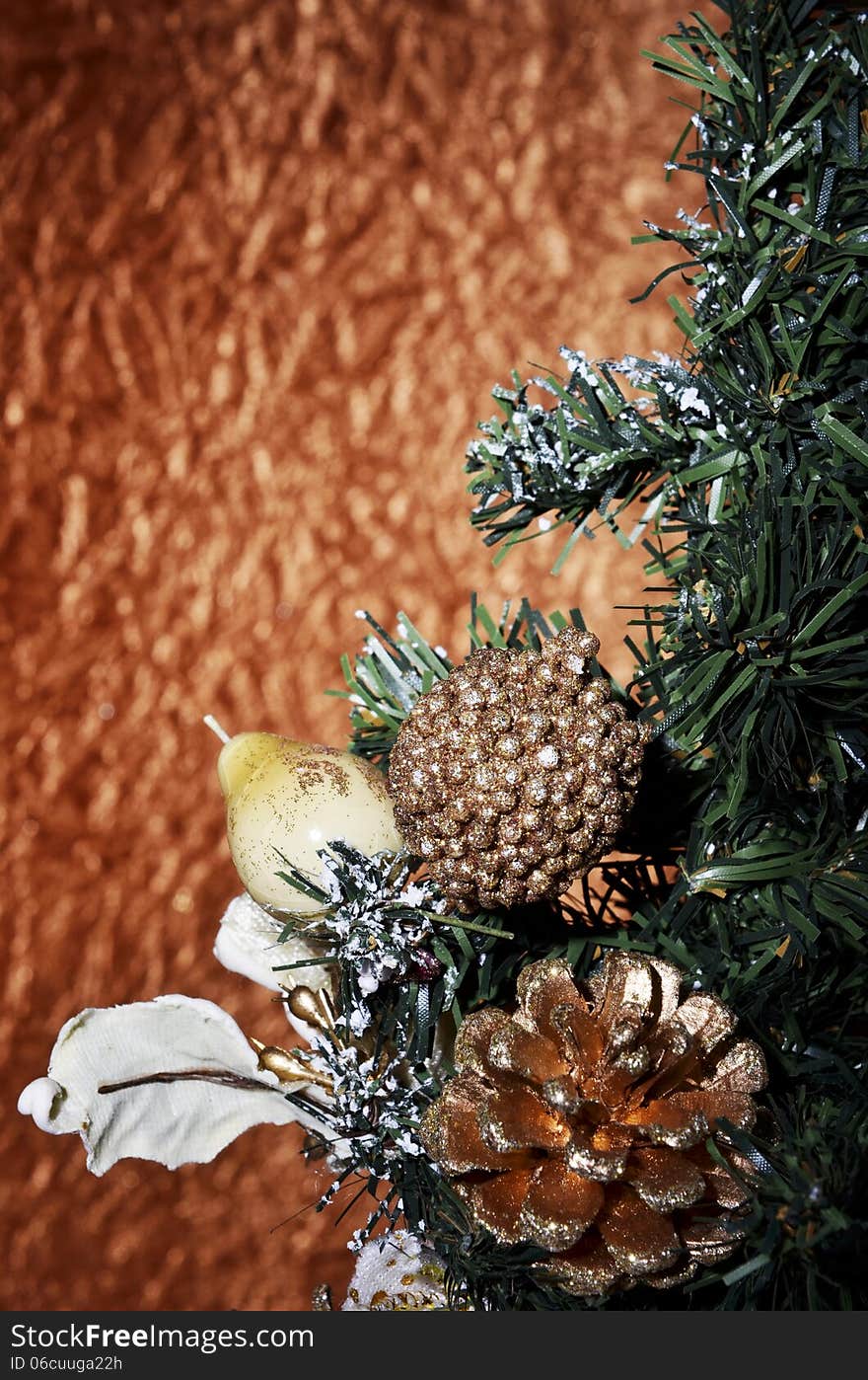 Christmas balls and Christmas tree on a gold background