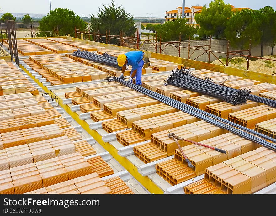 Worker engaged in the construction of a slab and masonry. Worker engaged in the construction of a slab and masonry