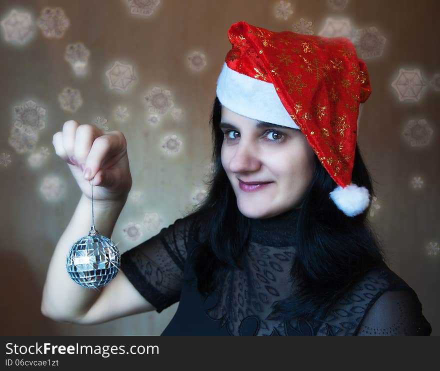 Young beautiful woman holding a mirror ball