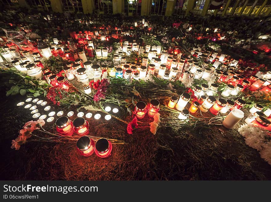 Huge amount of Flowers and Candles in front of place of a tragedy. Huge amount of Flowers and Candles in front of place of a tragedy