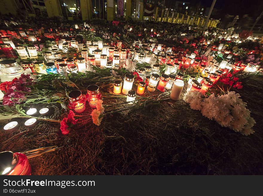 Huge amount of Flowers and Candles in front of place of a tragedy. Huge amount of Flowers and Candles in front of place of a tragedy