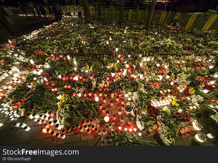 Huge amount of Flowers and Candles in front of place of a tragedy. Huge amount of Flowers and Candles in front of place of a tragedy