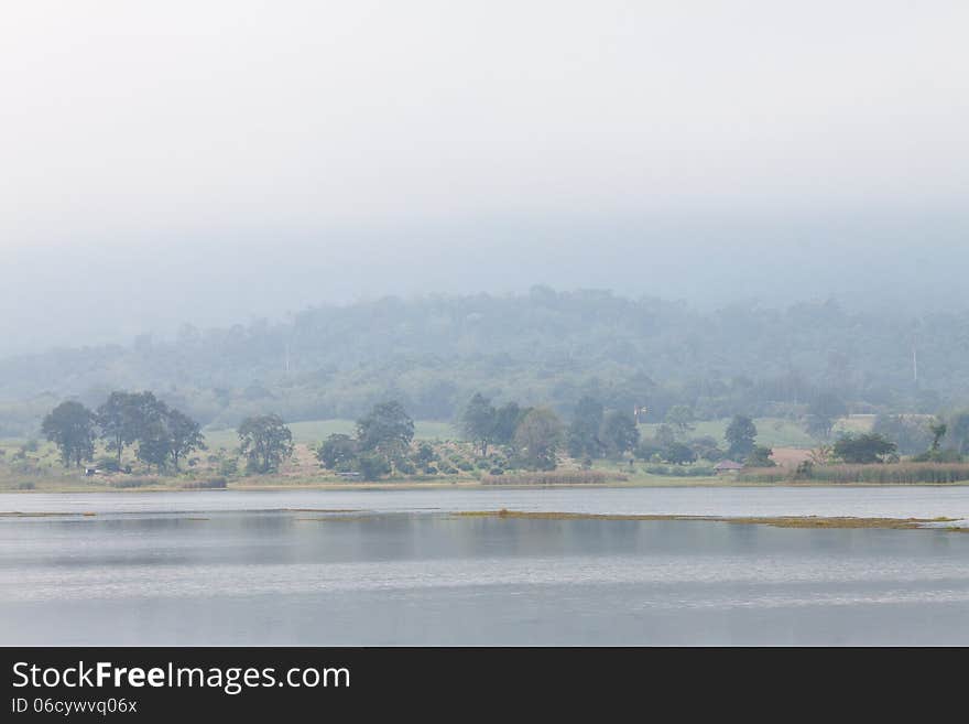 Landscape of forest and moutain along the reservoir that have the mist in the morning at Wang num keaw,Thailand. Landscape of forest and moutain along the reservoir that have the mist in the morning at Wang num keaw,Thailand