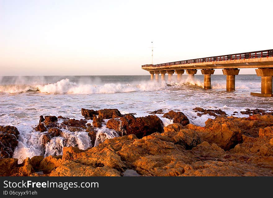 Waves crash under Shark Rock Pier on Port Elizabeth's beachfront in South Africa. Waves crash under Shark Rock Pier on Port Elizabeth's beachfront in South Africa.