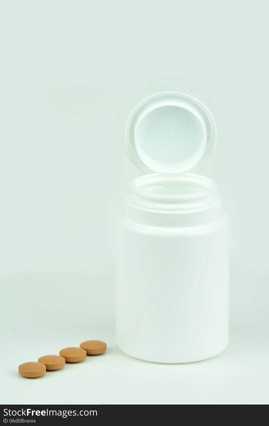 Pillbox and pills isolated pills i line