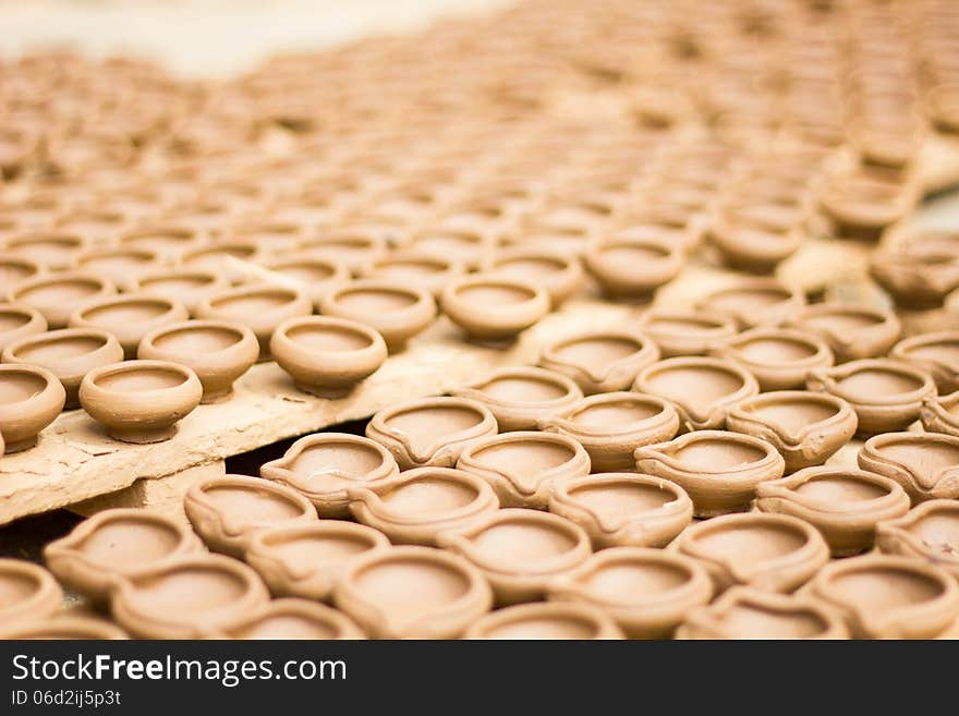 Indian diyas/cups made up of clay by pottery process. Indian diyas/cups made up of clay by pottery process