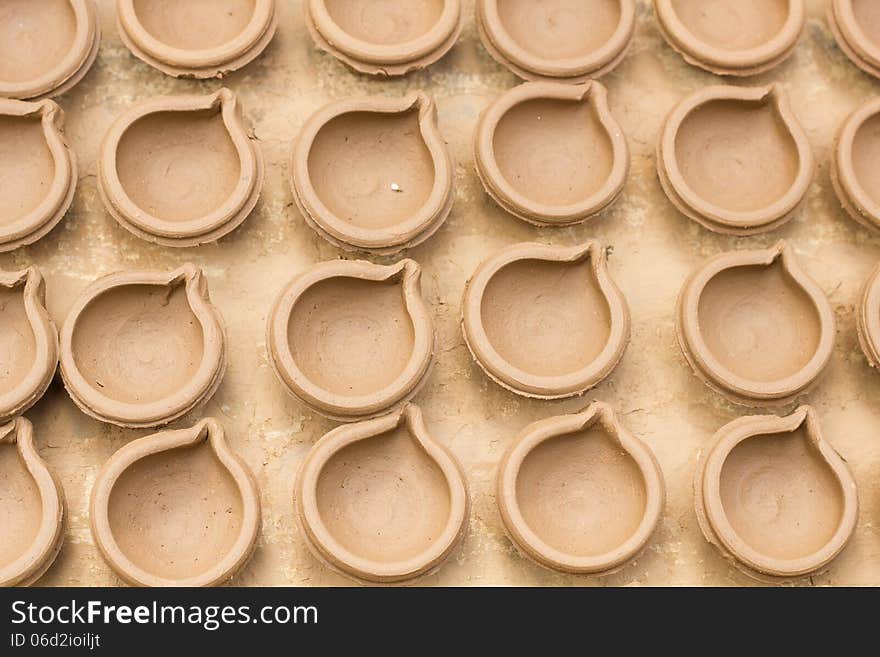 Indian diyas/cups made up of clay by pottery process. Indian diyas/cups made up of clay by pottery process