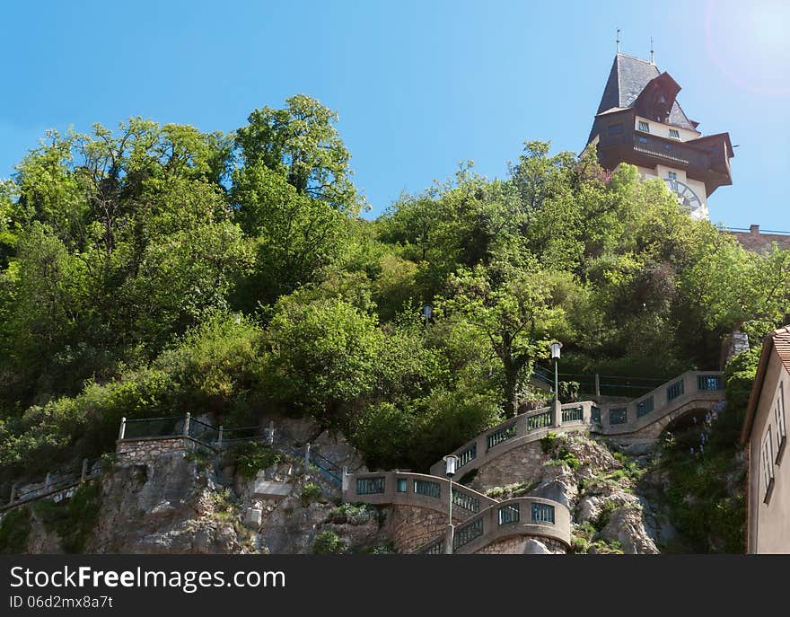 The clock tower on Schlossberg in the austian city of Graz. The clock tower on Schlossberg in the austian city of Graz