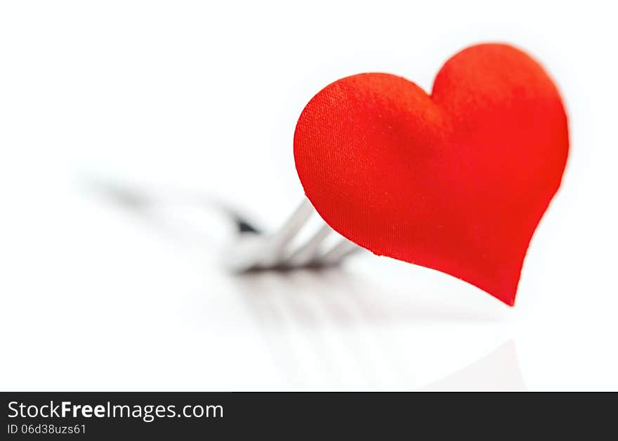 The red heart on a fork cutlery