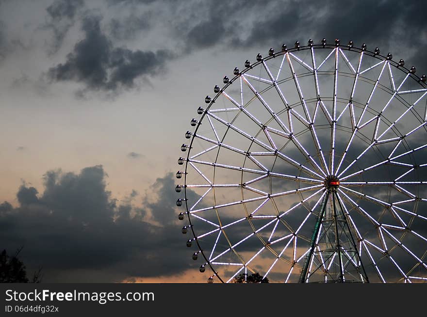 Ferris wheel against the dark sky