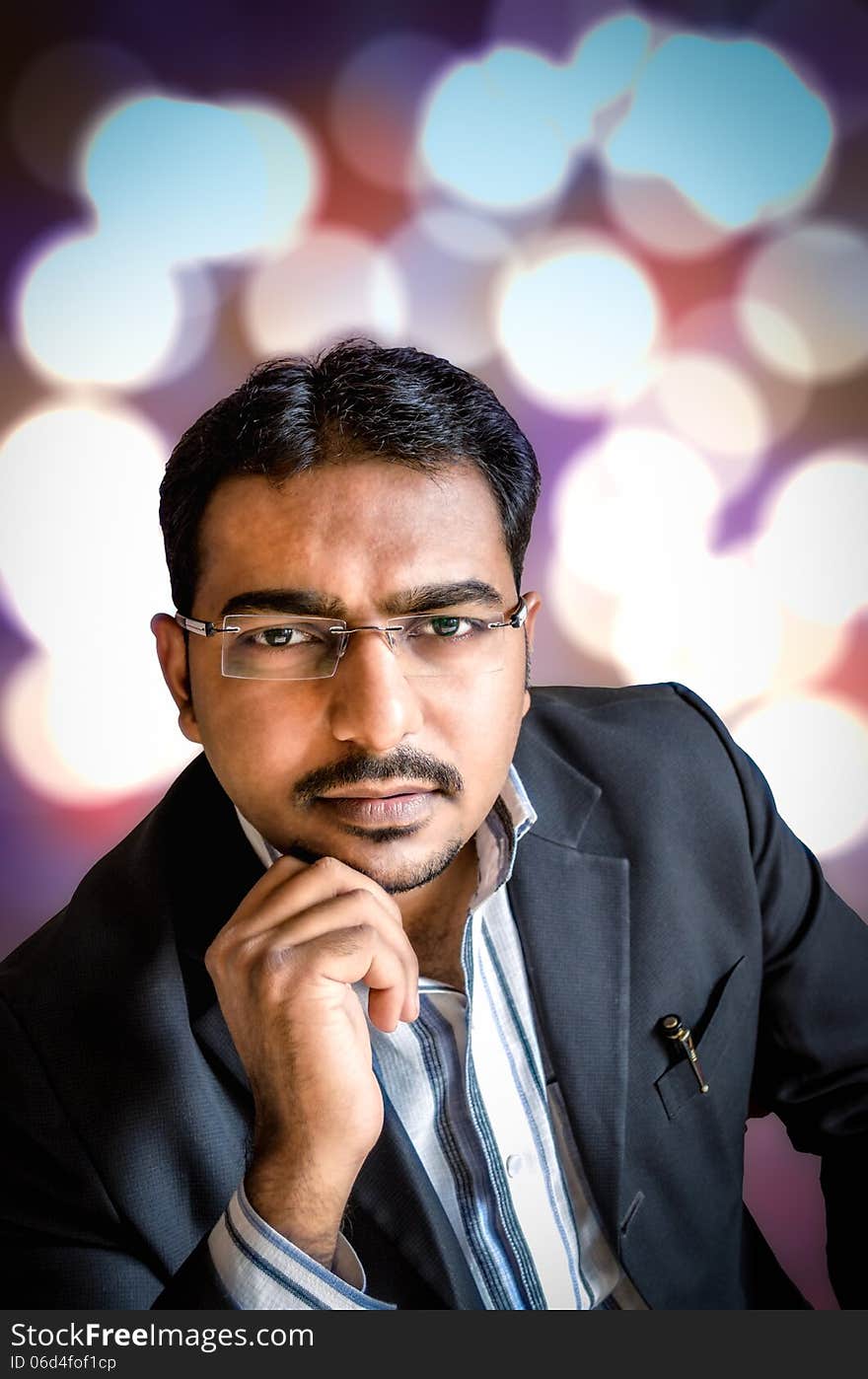 Portrait of young person wearing spects at night with bokeh lights in the background. Portrait of young person wearing spects at night with bokeh lights in the background