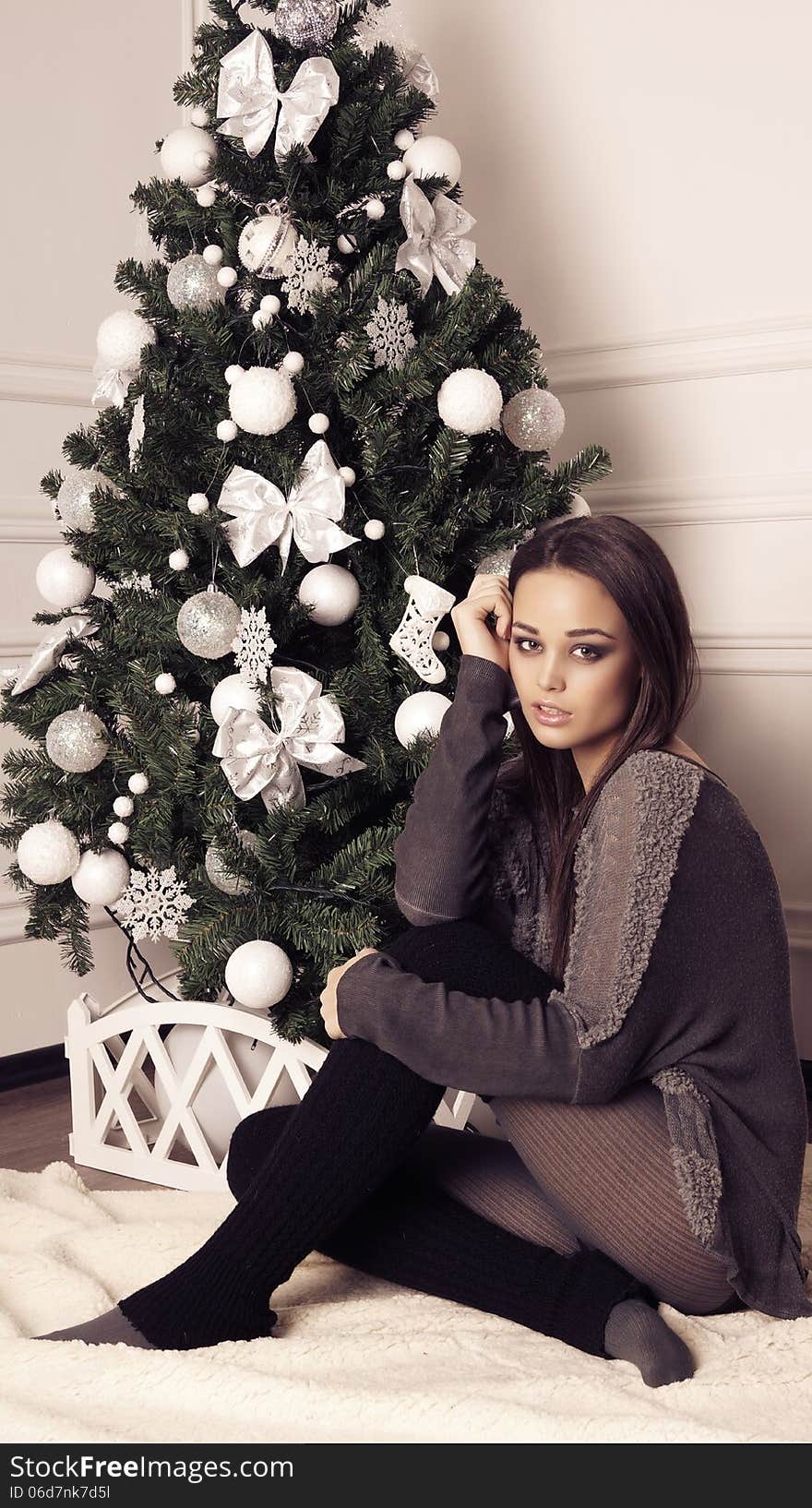 Beautiful girl with Christmas tree