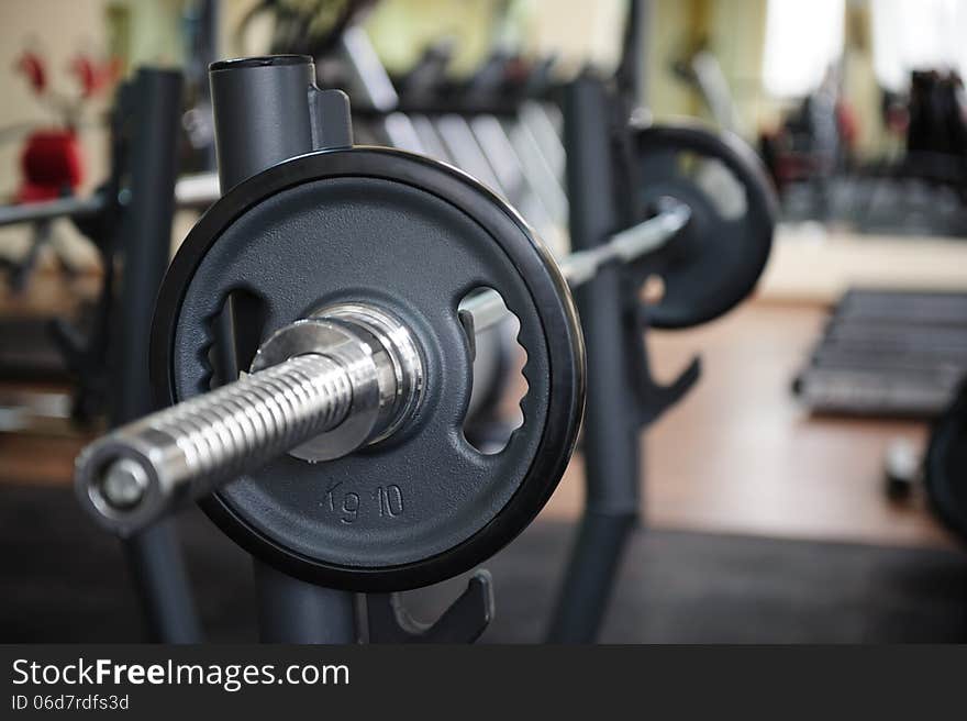 Barbell ready to workout, indooors, shallow DOF