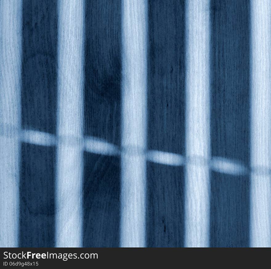 Background or texture blue shadow of the window blinds on the floor