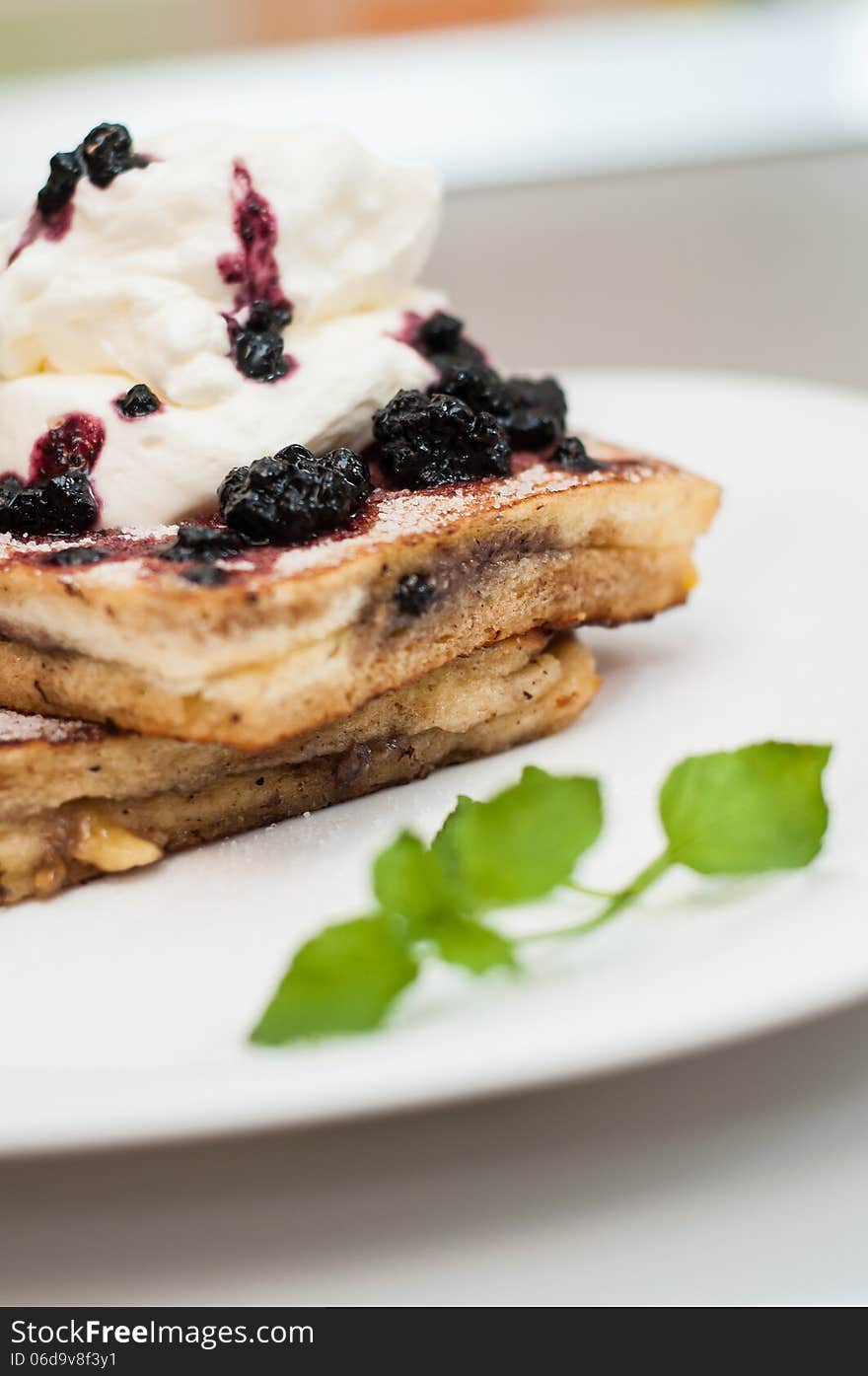 French toast with whip cream and blueberries jam