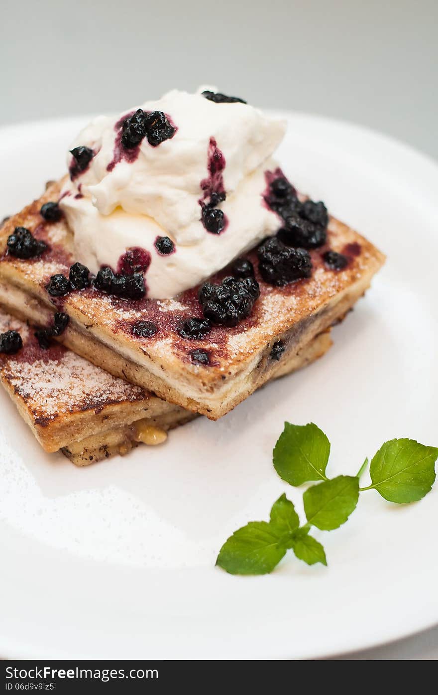 French toast with blueberry jam and whip-cream. French toast with blueberry jam and whip-cream