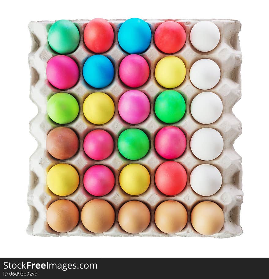 Multicolored Easter eggs in the cardboard box isolated on a white background