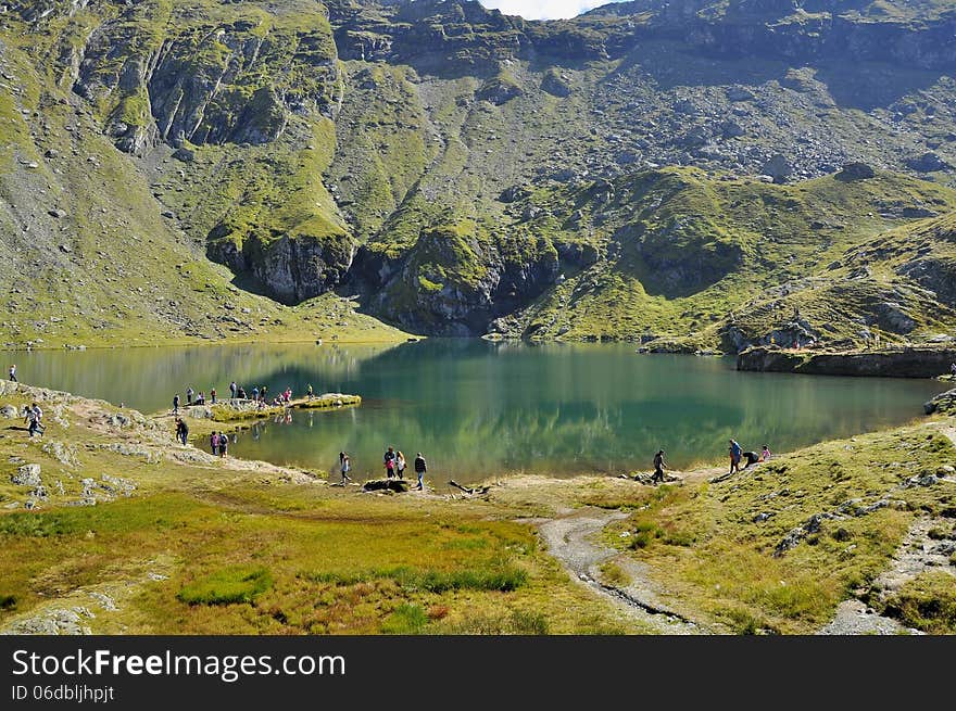 The Bâlea Lake is a glacier lake situated at 2,034 m of altitude in the Făgăraş Mountains, in central Romania, in Sibiu County. There are two chalets opened all the year round, a meteorological station and a mountain rescue station. It is accessible by car on the Transfăgărăşan road during the summer, and the rest of the year by a cable car from the Bâlea Waterfall chalet. The resort offers nature trails medium-advanced class, is a real paradise for lovers of extreme sports. Here you can practice ski, snowboard, gave the bag, sleighing, etc.. Partia Balea Lac is one of the most popular ski slopes in Romania by professionals and those who love extreme sports. Snow is present in November / December to July and has a very good quality for carrying ski’s.This dreamy landscape is spectacular and the traditional cabin on the lake is wonderful. The Bâlea Lake is a glacier lake situated at 2,034 m of altitude in the Făgăraş Mountains, in central Romania, in Sibiu County. There are two chalets opened all the year round, a meteorological station and a mountain rescue station. It is accessible by car on the Transfăgărăşan road during the summer, and the rest of the year by a cable car from the Bâlea Waterfall chalet. The resort offers nature trails medium-advanced class, is a real paradise for lovers of extreme sports. Here you can practice ski, snowboard, gave the bag, sleighing, etc.. Partia Balea Lac is one of the most popular ski slopes in Romania by professionals and those who love extreme sports. Snow is present in November / December to July and has a very good quality for carrying ski’s.This dreamy landscape is spectacular and the traditional cabin on the lake is wonderful.