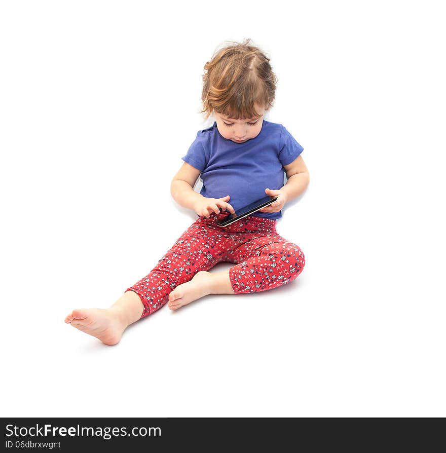 Little kid playing smartphone on white background. Little kid playing smartphone on white background