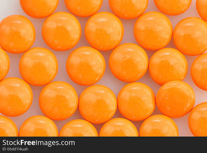 Background of stack orange pills. Background of stack orange pills