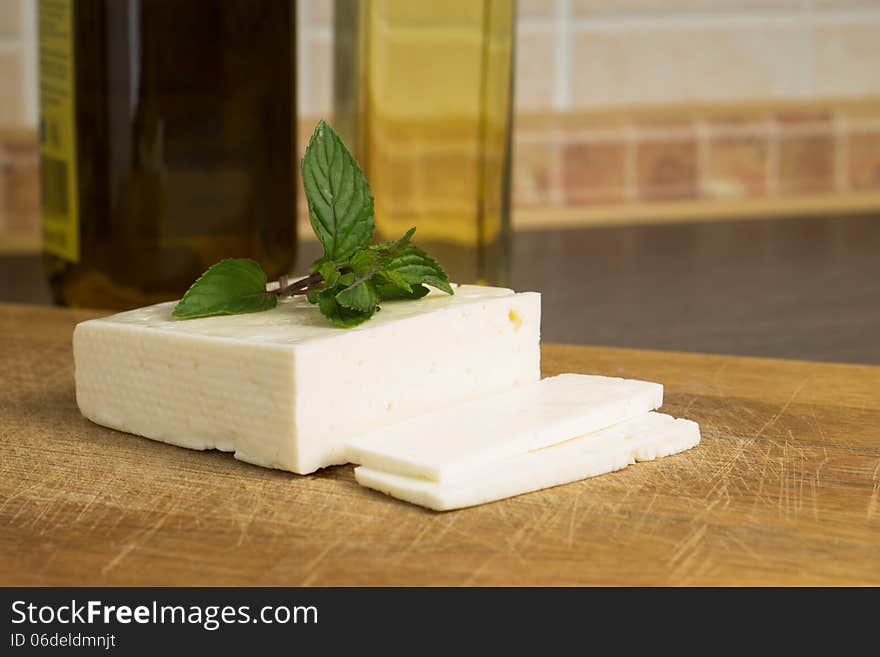 Sliced White salted cheese on the kitchen table