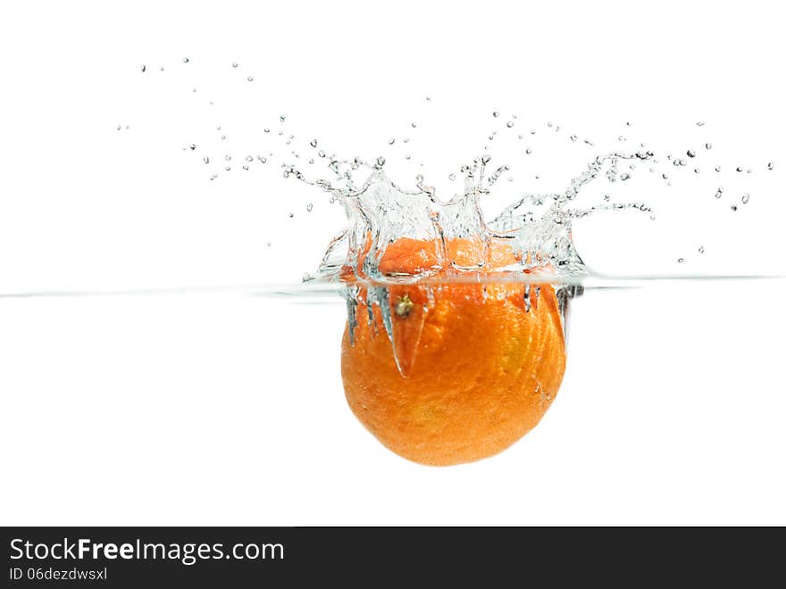 Orange falling into the water. Orange falling into the water