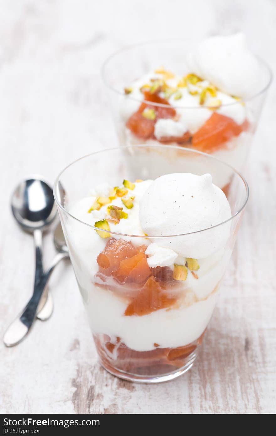 Dessert with peaches, whipped cream and meringue